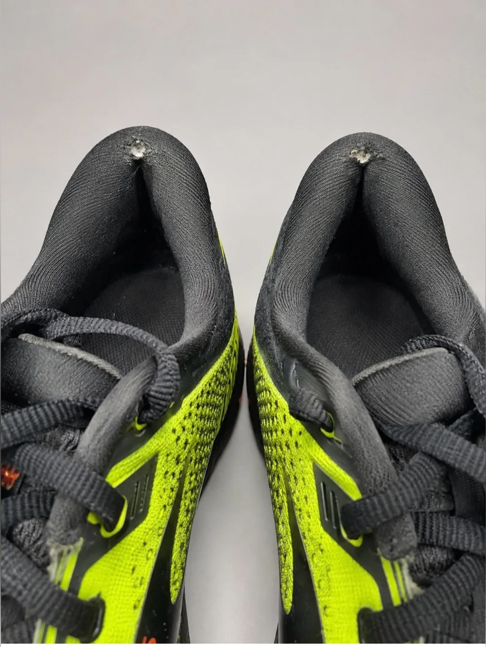 Brooks Adrenaline GTS 22 men's running shoes in a bright neon yellow, black
